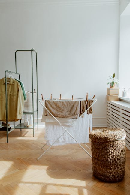 pexels photo 10565616 10565616 1 A tidy laundry room with clothes drying and a wicker basket in sunlight.