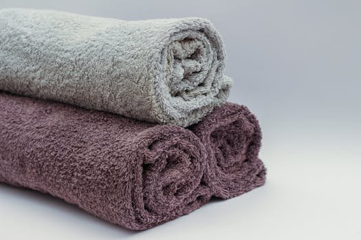 pexels photo 45980 45980 Close-up of rolled bathroom towels in neutral tones, ideal for interior design or spa themes.